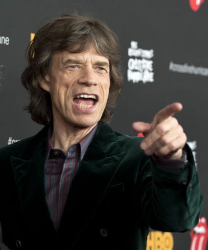 Rolling Stones' lead singer Mick Jagger, pictured here on November 13, donned a black feathered cape to perform "Sympathy For The Devil" at the O2 Arena in London, before a rousing rendition of "Jumping Jack Flash" ended the night