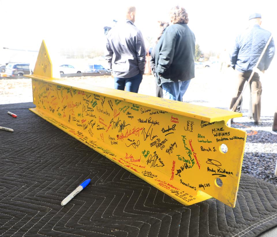 Signatures cover the final steel girder for the Food Bank of the Hudson Valley's new building in Montgomery on March 7, 2024. The Food Bank celebrated the topping out ceremony Thursday morning and hopes to have the building up and running later this year.