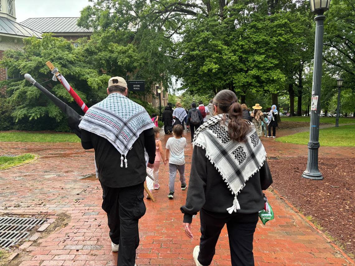 Two pro-Palestinan protesters with keffiyehs leave Polk Place on the campus of UNC-Chapel Hill on MAy 5, 2024. Brian Gordon /bgordon@newsobserver.com