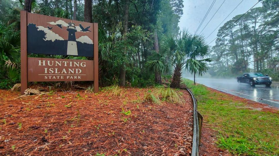 A truck travels along S.C. Hwy. 21 on Aug. 4, 2023 passing the main entrance to South Carolina’s Hunting Island State Park during an afternoon rainstorm.