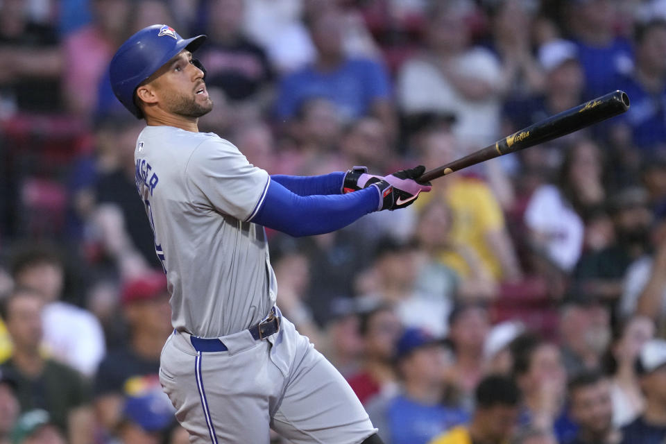 Toronto Blue Jays' George Springer watches his two-run home run against the Boston Red Sox during the third inning of a baseball game at Fenway Park, Tuesday, June 25, 2024, in Boston. (AP Photo/Charles Krupa)