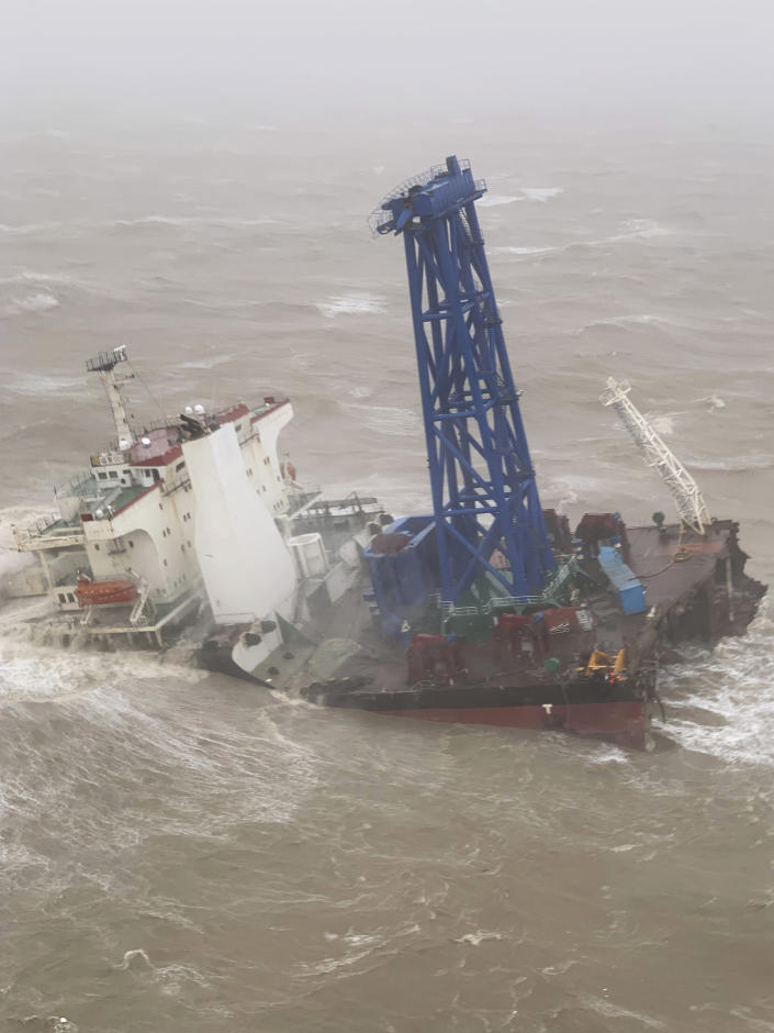This photo released by Hong Kong Government Flying Service shows a cargo ship broken in half in the South China Sea, 300 kilometers (186 miles) south of Hong Kong, Saturday, July 2, 2022, as Typhoon Chaba was moving in the area. The industrial support ship operating in the South China Sea has sunk with the possible loss of more than two dozen crew members, rescue services in Hong Kong said Saturday. (Hong Kong Government Flying Service via AP)