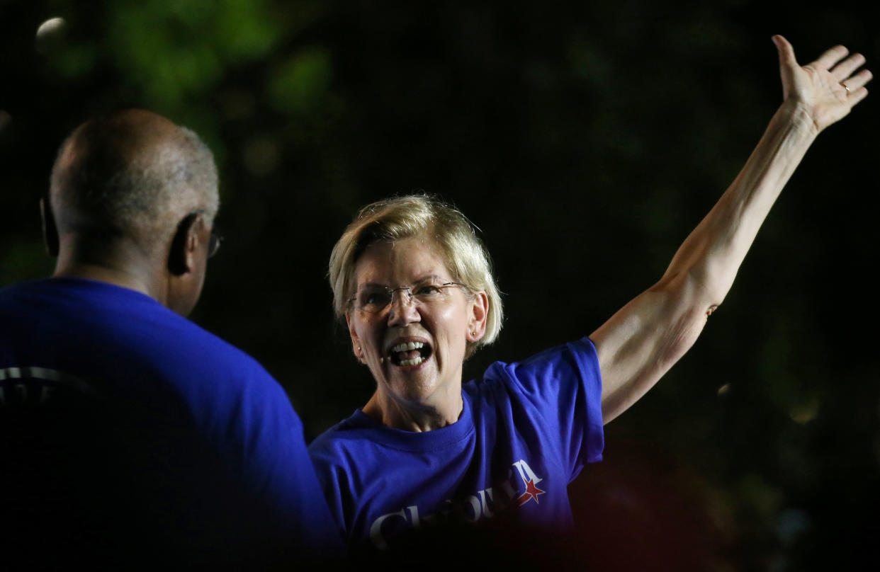 Democratic presidential candidate Elizabeth Warren goes in for a hug with Rep. Jim Clyburn during Jim Clyburn's World Famous Fish Fry in Columbia, South Carolina, U.S., June 21, 2019.  Picture taken June 21, 2019. REUTERS/Leah Millis