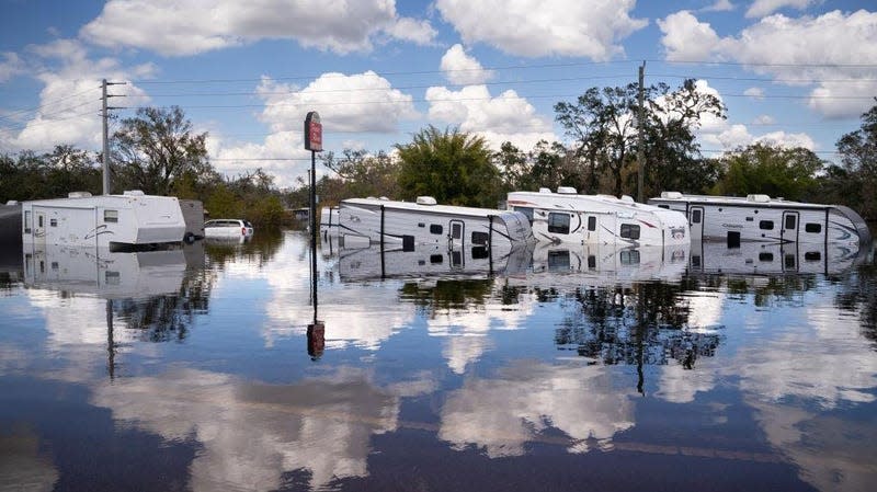 Trailers are inundated by floodwaters at the Peace River Campground on October 4, 2022 in Arcadia, Florida.