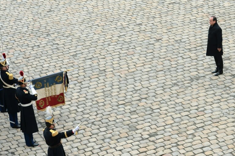 Francois Hollande (right) attends a ceremony in honour of the 130 people killed in the November 13 Paris attacks