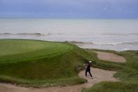 Team USA's Xander Schauffele hits to the third green during a practice day at the Ryder Cup at the Whistling Straits Golf Course Thursday, Sept. 23, 2021, in Sheboygan, Wis. (AP Photo/Jeff Roberson)