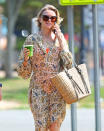 <p>Naomi Watts grabs a green juice to-go in The Hamptons, New York, on Aug. 3. </p>