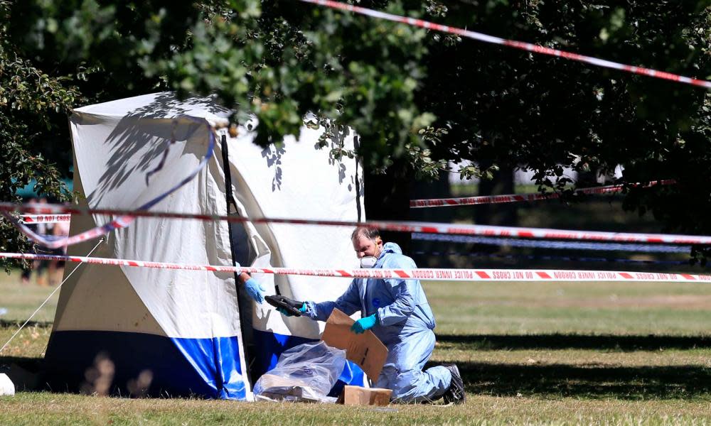 A forensic officer at a crime scene in central London.