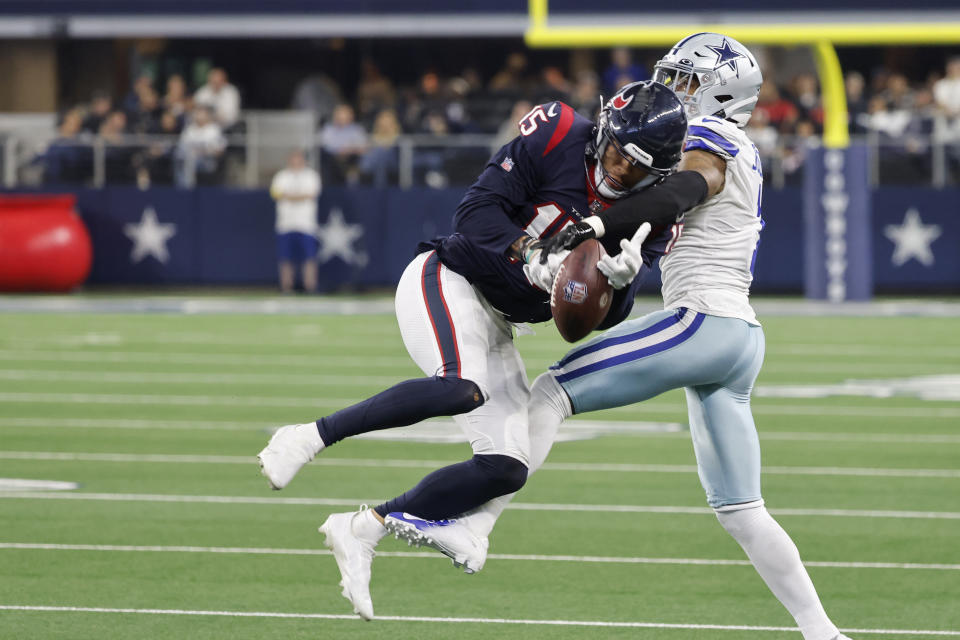 Dallas Cowboys cornerback Kelvin Joseph (1) breaks p a pass intended for Houston Texans wide receiver Chris Moore (15) during the second half of an NFL football game, Sunday, Dec. 11, 2022, in Arlington, Texas. (AP Photo/Michael Ainsworth)