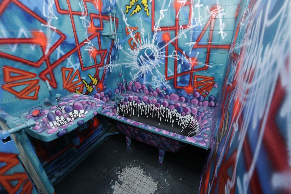 A bathroom, painted by France's street artist Uno is seen at the Paris Tour 13 street art project in Paris