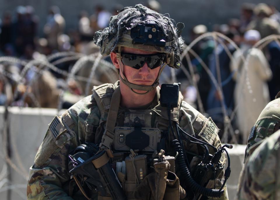 A paratrooper assigned to the 1st Brigade Combat Team, 82nd Airborne Division conducts security as the Division continues to help facilitate the safe evacuation of U.S. citizens, Special Immigrant Visa applicants, and other at-risk Afghans out of Afghanistan as quickly and safely as possible from Hamid Karzai International Airport in Kabul on Aug 26. 2021.