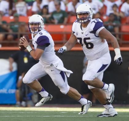 Washington quarterback Jeff Lindquist (5) rolls out to pass while being protected by offensive linesman Dexter Charles (76) in the second quarter of an NCAA college football game against Hawaii, Saturday, Aug. 30, 2014, in Honolulu. (AP Photo/Eugene Tanner)