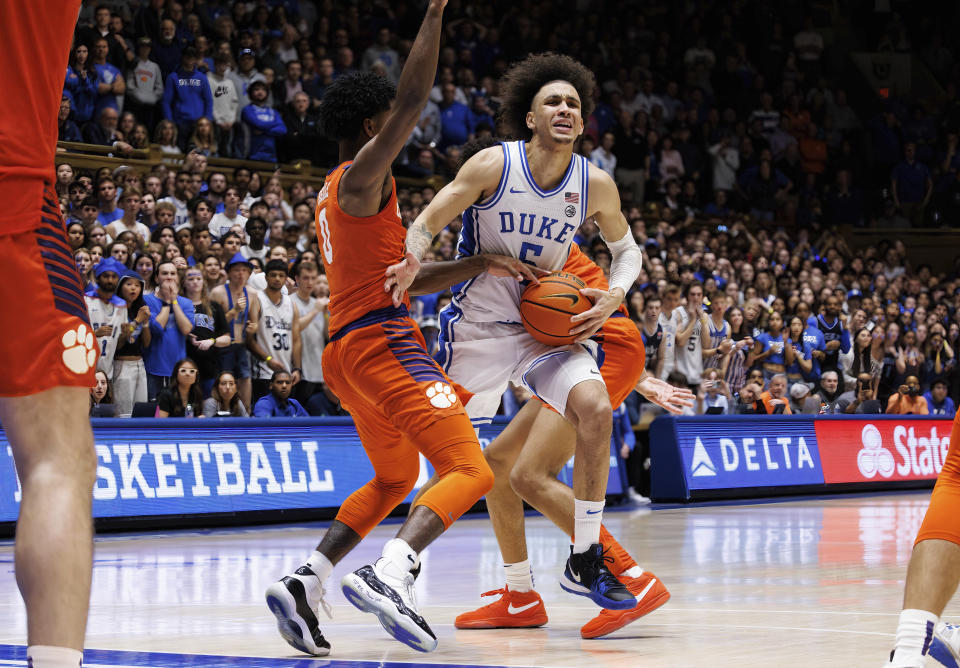 Duke's Tyrese Proctor (5) drives and draws a foul on Clemson's Josh Beadle (0) in the final seconds of an NCAA college basketball game in Durham, N.C., Saturday, Jan. 27, 2024. (AP Photo/Ben McKeown)