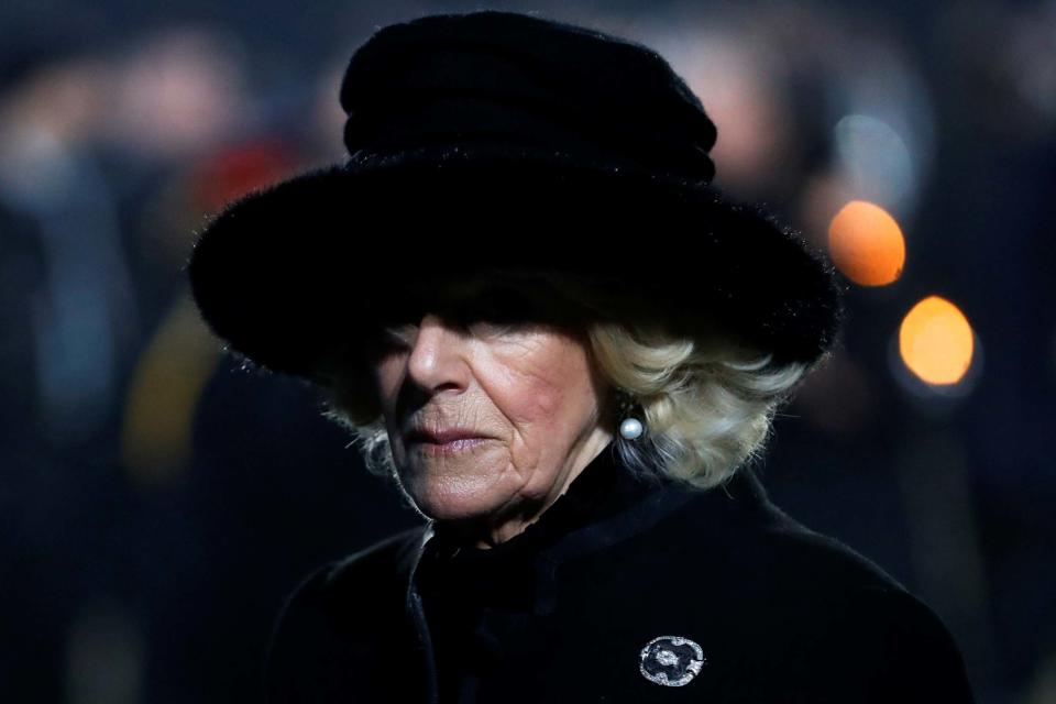 The Duchess of Cornwall looks somberly at the Monument to the Victims at Auschwitz-Birkenau (REUTERS)