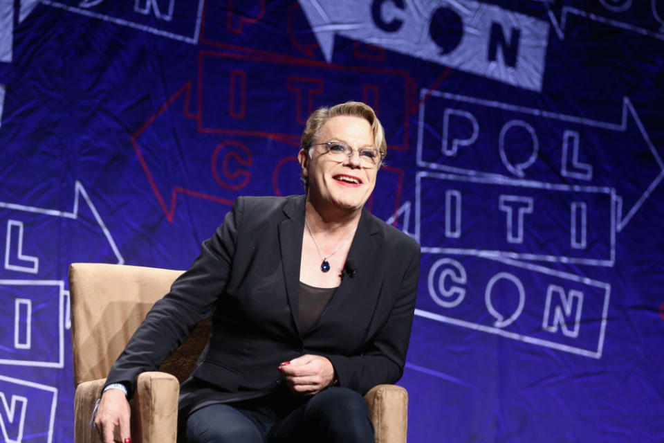 Eddie Izzard speaks on stage during a political event