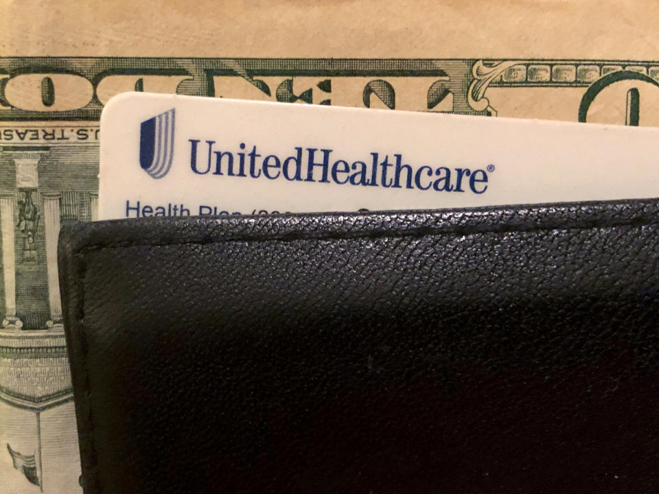 FILE PHOTO: A UnitedHealth Group health insurance card is seen in a wallet in this picture illustration October 14, 2019. REUTERS/Lucy Nicholson/Illustration/File Photo