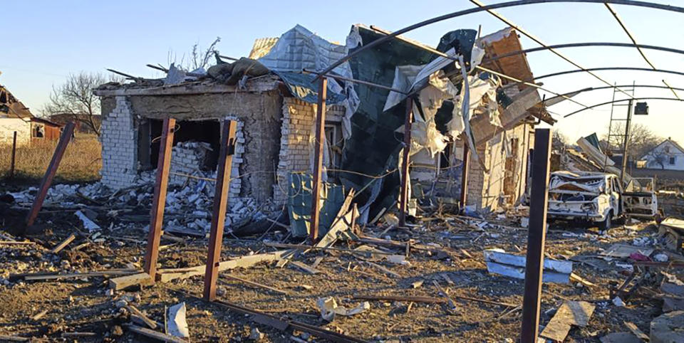 In this photo provided by the Zaporizhzhia region military administration, a damaged building and a car are seen after a Russian strike in the village of Novosofiivka, in the Zaporizhzhia region, Ukraine, Monday, Dec. 5, 2022. Ukrainian officials reported a new barrage of Russian missile strikes across the country Monday, an attack that was anticipated as Russia seeks to disable Ukraine's energy supplies and infrastructure with the approach of winter. (Zaporizhzhia region military administration via AP)