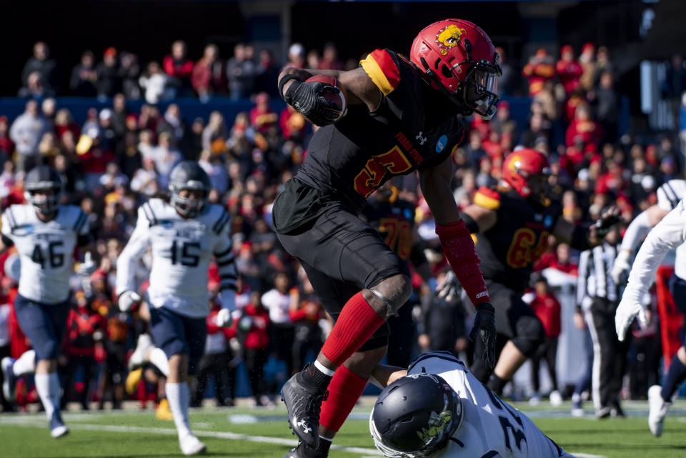 Ferris State slot receiver CJ Jefferson (5) leaps over Colorado School of Mines safety Jaden Williams (32) in the first half of the NCAA Division II championship against Colorado School of Mines on Saturday, Dec. 17, 2022 in McKinney, Texas.