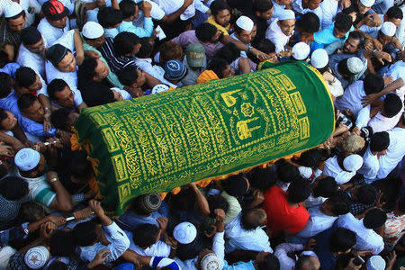 Supporters carry the coffin of Ko Ni, a prominent member of Myanmar's Muslim minority and legal adviser for Myanmar's ruling National League for Democracy, after he was shot dead, in Yangon, Myanmar January 30, 2017. REUTERS/Mg Nyi Nyi