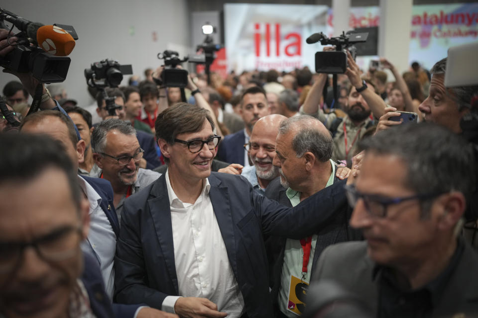 Socialist candidate Salvador Illa greets supporters after the announcement of the results of the elections to the Catalan parliament in Barcelona, Sunday May 12, 2024. The Socialists led by former health minister Illa won a majority of 42 seats, up from their 33 seats in 2021 when they also barely won the most votes but were unable to form a government. They will still need to earn the backing of other parties to put Illa in charge.(AP Photo/Emilio Morenatti)