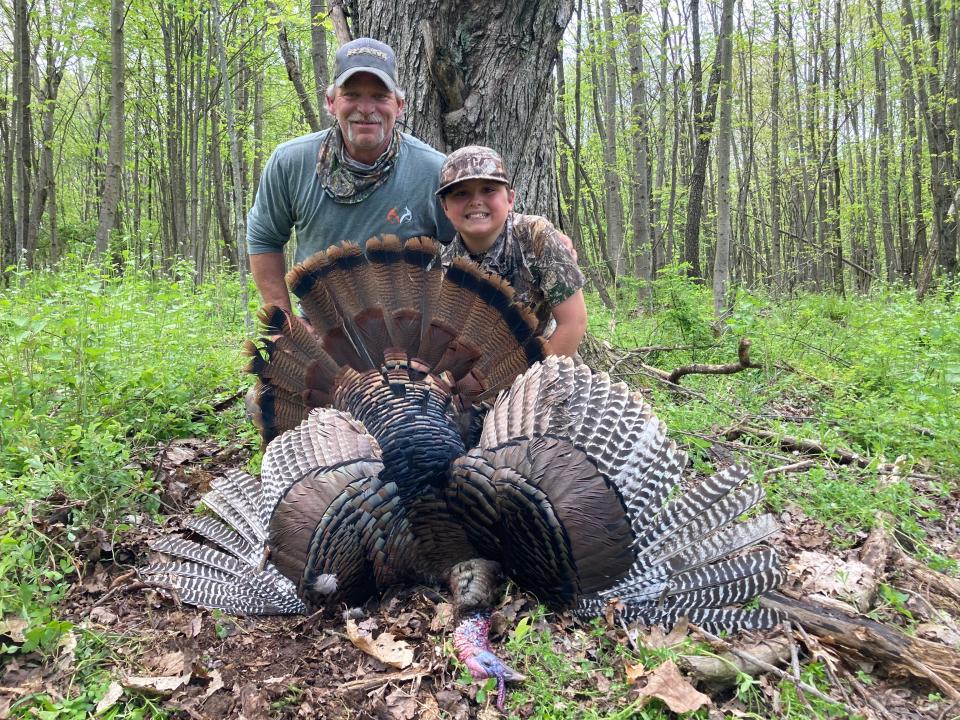 Guide Steve Zinn and Harrison with his Ohio gobbler.