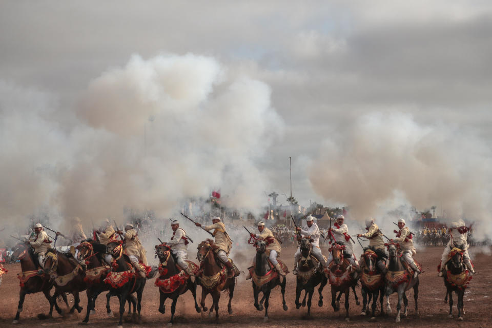 A troupe charges and fires their rifles during Tabourida, a traditional horse riding show also known as Fantasia, in the coastal town of El Jadida, Morocco, on July 25, 2019. (AP Photo/Mosa'ab Elshamy)