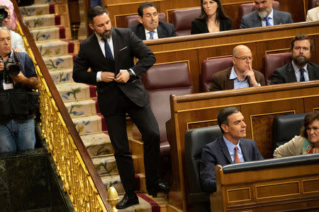 Santiago Abascal, leader of far-right party VOX, walks down the stairs past acting Prime Minister Pedro Sanchez as they attend the first session of parliament following a general election in Madrid, Spain, May 21, 2019. Bernat Armangue/Pool via REUTERS