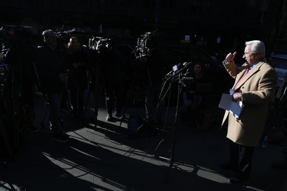 Attorney Bob Costello, right, talks to reporters after testifying before a grand jury investigating Donald Trump in New York, Monday, March 20, 2023. (AP Photo/Seth Wenig)