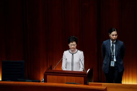 Hong Kong Chief Executive Carrie Lam is seen on a screen as she reacts to protest by pro-democracy lawmakers, at the Legislative Council in Hong Kong