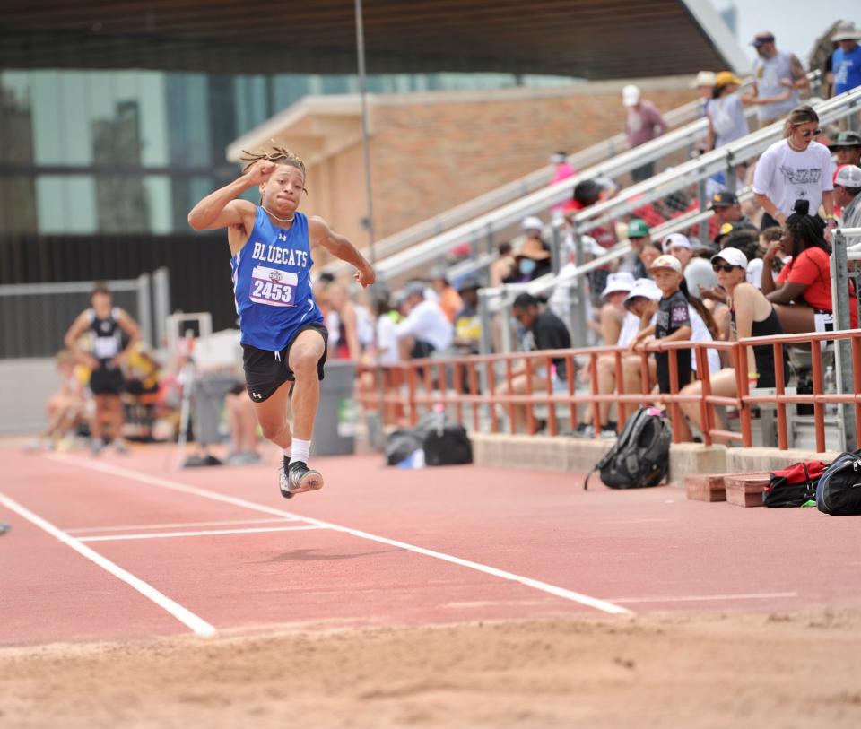 Coleman's Devinar Roberson competes in the triple jump at the state track and field meet in Austin.