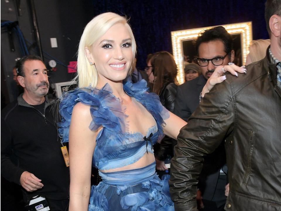 Gwen Stefani smiling backstage at a People's Choice awards.