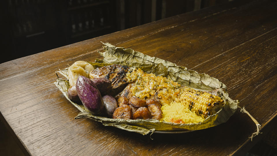 New Soul Food’s Afro-Creole platter, with braised fish in creole sauce, attiéké, basmati rice, corn on the cob and plantains, served on banana leaves. - Credit: Laura Stevens