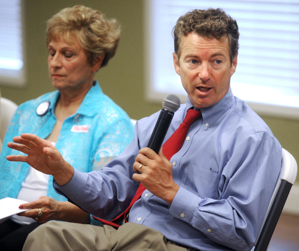 Sen. Rand Paul, R-Ky., takes questions Monday, July 1, 2013, from about 40 Owensboro Tea Party members at the Logsdon Community Center in Owensboro, Ky. During his remarks Paul said he supports granting more work visas if the border is secured first. (AP Photo/The Messenger-Inquirer, Gary Emord-Netzley)