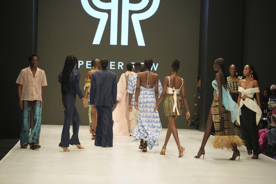 Models wear a creation by Pepper Row during the Lagos Fashion Week in Lagos, Nigeria, Thursday, Oct. 26, 2023. Africa's fashion industry is rapidly growing to meet local and international demands but a lack of adequate investment still limits its full potential, UNESCO said Thursday in its new report released at this year's Lagos Fashion Week show. (AP Photo/Sunday Alamba)