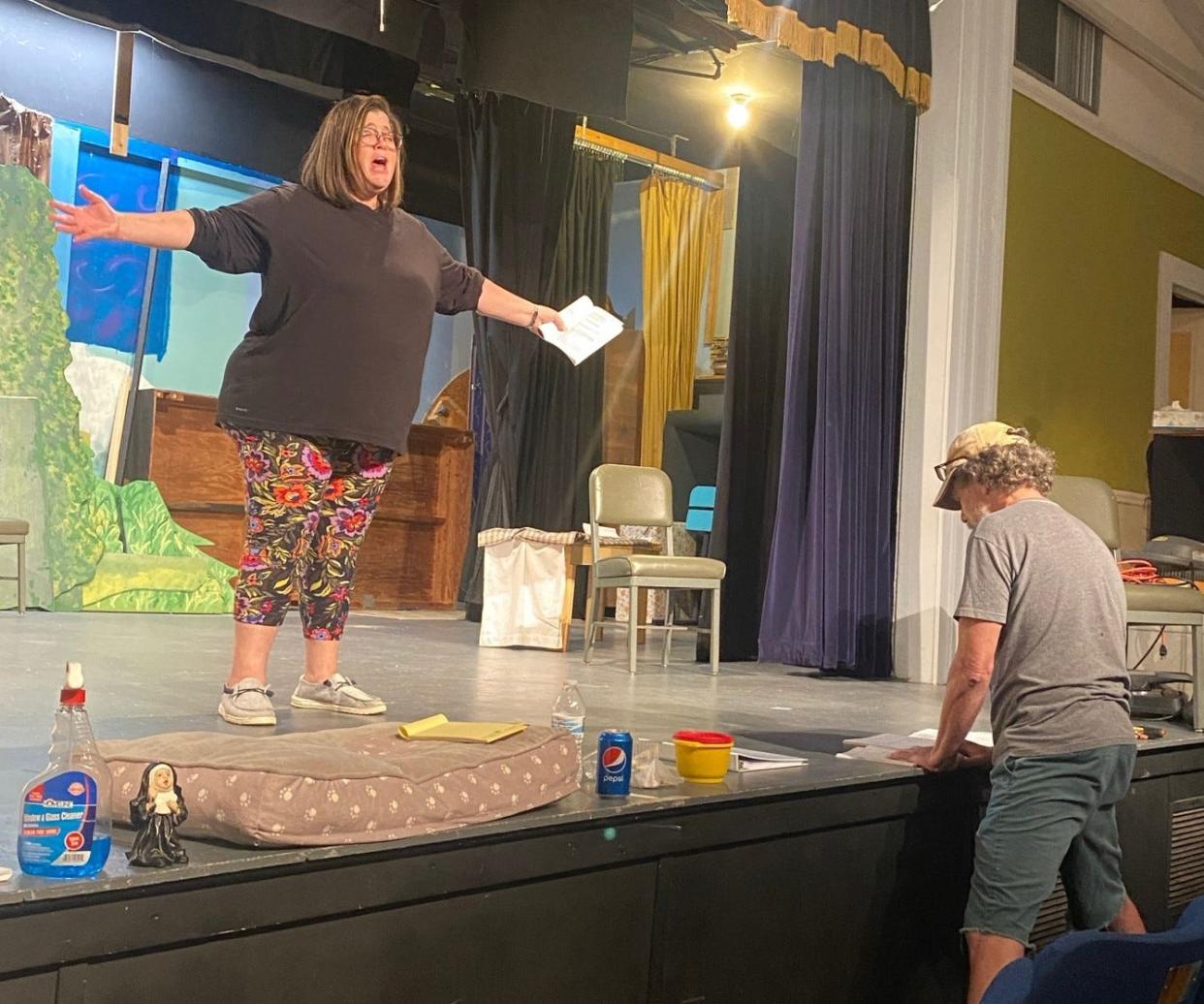 Leslie O. Stavely and director Brad Smith rehearse lines in preparation for Stavely's role as Sister Mary Amnesia in The Schoolhouse Players' production of Nunsense earlier this year.