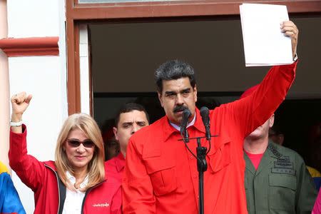 Venezuela's President Nicolas Maduro attends a rally in support of his government and to commemorate the 61st anniversary of the end of the dictatorship of Marcos Perez Jimenez next to his wife Cilia Flores in Caracas, Venezuela January 23, 2019. Miraflores Palace/Handout via REUTERS ATTENTION EDITORS - THIS PICTURE WAS PROVIDED BY A THIRD PARTY