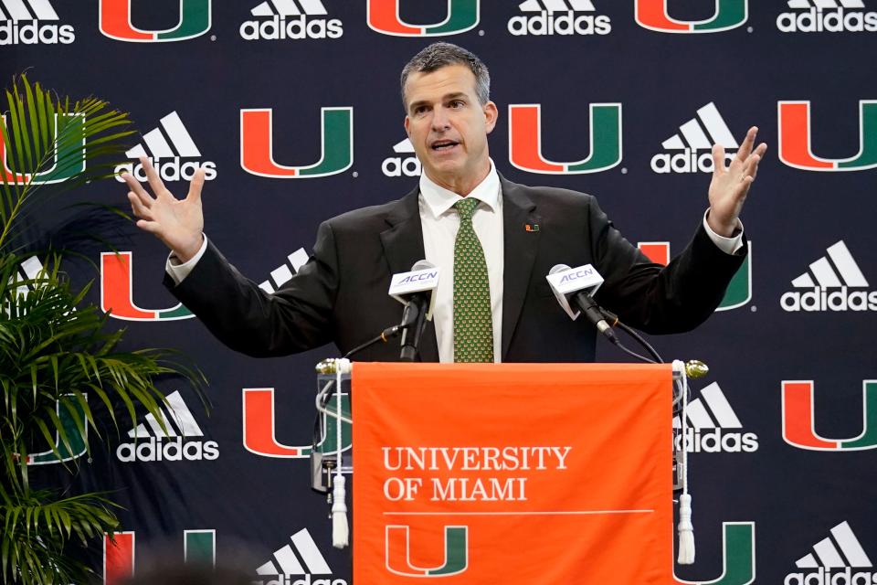 Miami football coach Mario Cristobal speaks after being introduced at a news conference, Tuesday, Dec. 7, 2021, in Coral Gables, Fla. Cristobal is returning to his alma mater, where he won two championships as a player.