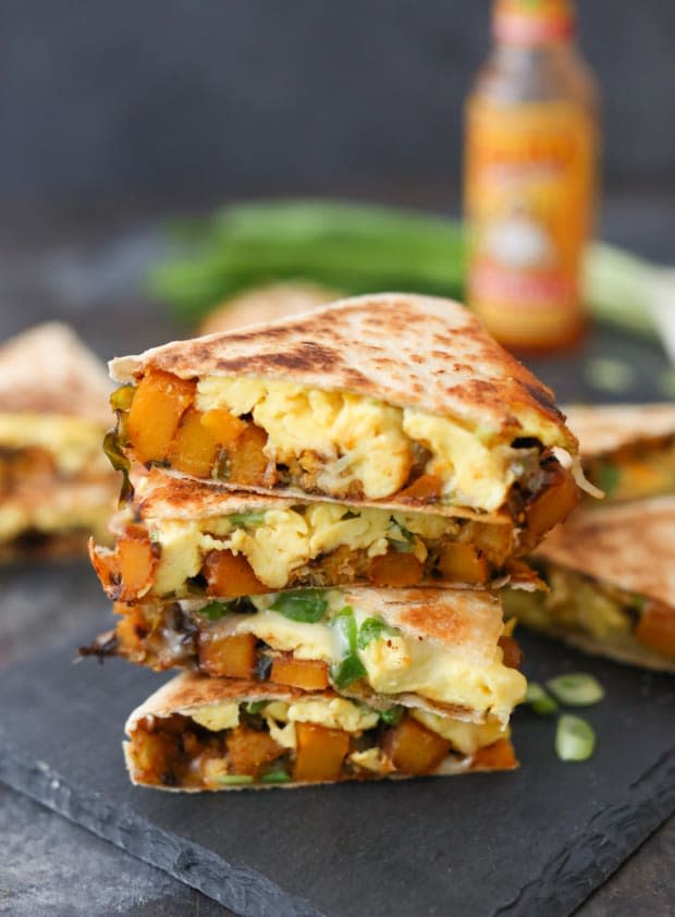 <p>Loaded with smoky-sweet squash, shaved Brussels sprouts, fluffy scrambled eggs, scallions and Monterey Jack, these breakfast quesadillas are packed with flavor and nutrition!</p><p><strong>Get the recipe: <a href="https://domesticate-me.com/butternut-and-brussels-sprout-breakfast-quesadillas/" rel="nofollow noopener" target="_blank" data-ylk="slk:Butternut and Brussels Sprout Breakfast Quesadillas;elm:context_link;itc:0;sec:content-canvas" class="link "><em>Butternut and Brussels Sprout Breakfast Quesadillas</em></a></strong></p><p>Domesticate Me</p>