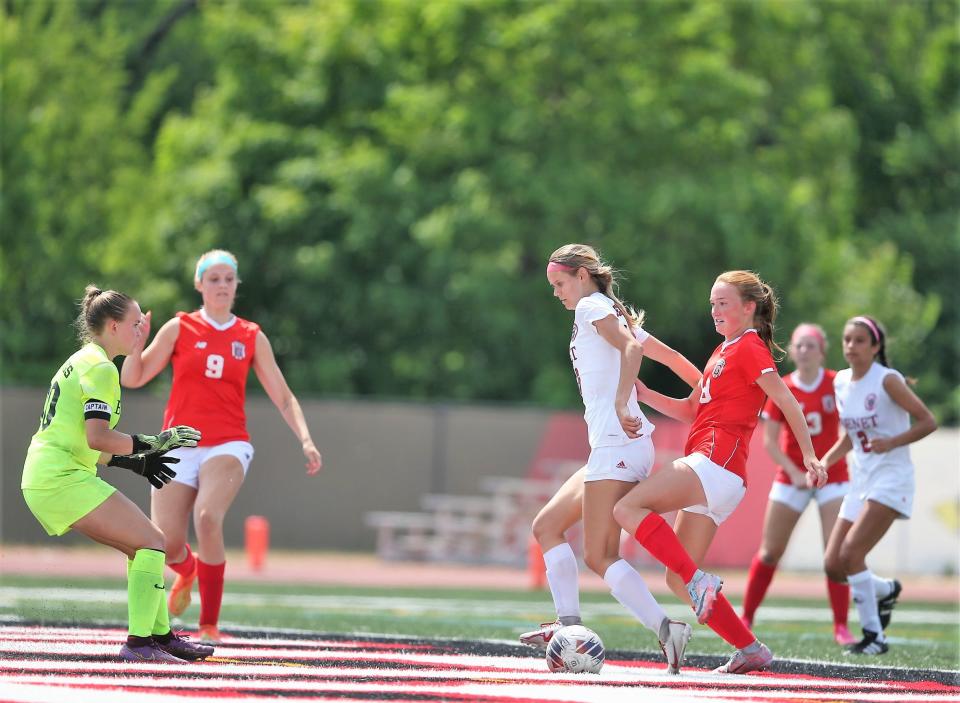 Chatham Glenwood's Rowann Law, right, aims for the go-ahead goal against Lisle Benet Academy during the first overtime of the Class 2A girls soccer state championship game at Benedetti–Wehrli Stadium in Naperville on Saturday, June 3, 2023.