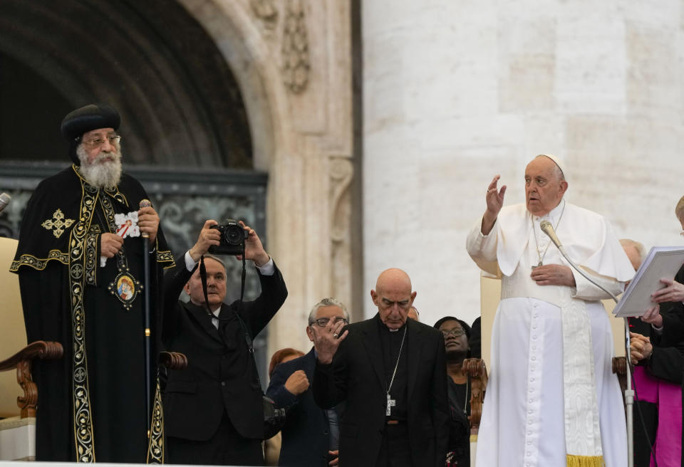 Pope Francis, right, starts his weekly general audience in St. Peter's Square at The Vatican, with the leader of the Coptic Orthodox Church of Alexandria, Tawadros II,Wednesday, May 10, 2023. (AP Photo/Alessandra Tarantino)