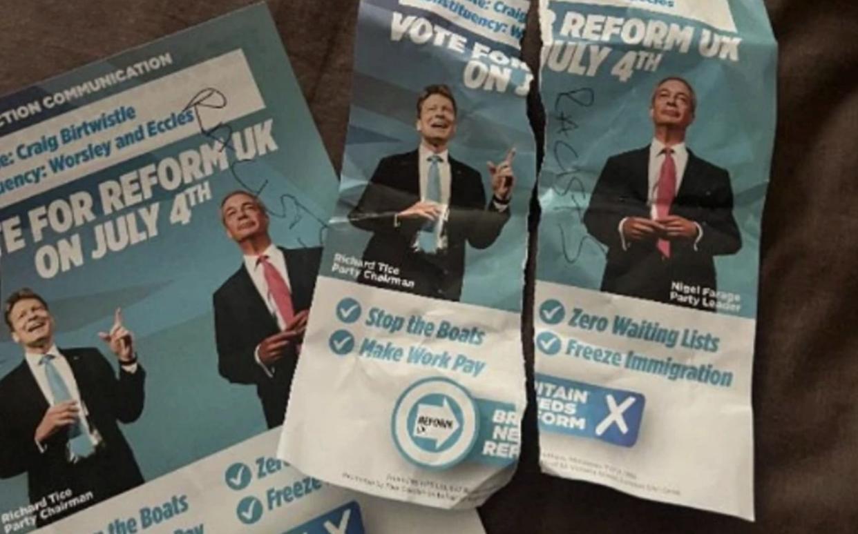Reform leaflets with 'racists' scrawled on them