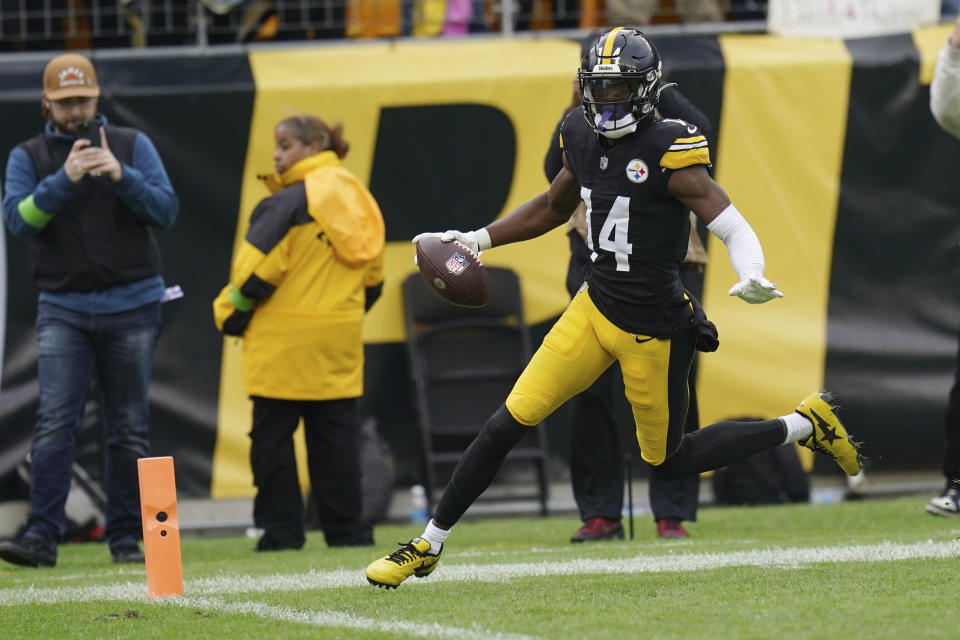 Pittsburgh Steelers wide receiver George Pickens (14) runs into the endzone for a touchdown in the second half of an NFL football game against the Baltimore Ravens, in Pittsburgh, Sunday, Oct. 8, 2023. (AP Photo/Matt Freed)