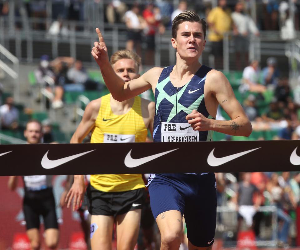 Jakob Ingebrigtsen, right, wins the Bowerman Mile ahead of Stewart McSweyn, left, at  Prefontaine Classic at Hayward Field Saturday.