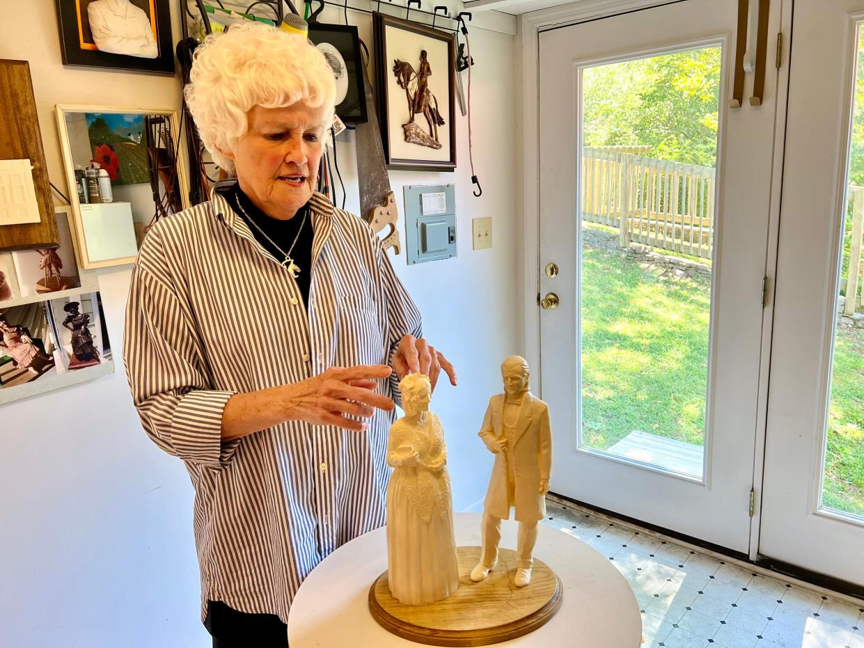 Columbia artist and sculptor Jennifer Grisham presents scale models of James and Sarah Polk, which she created for the city's Polks at Preservation Park project.