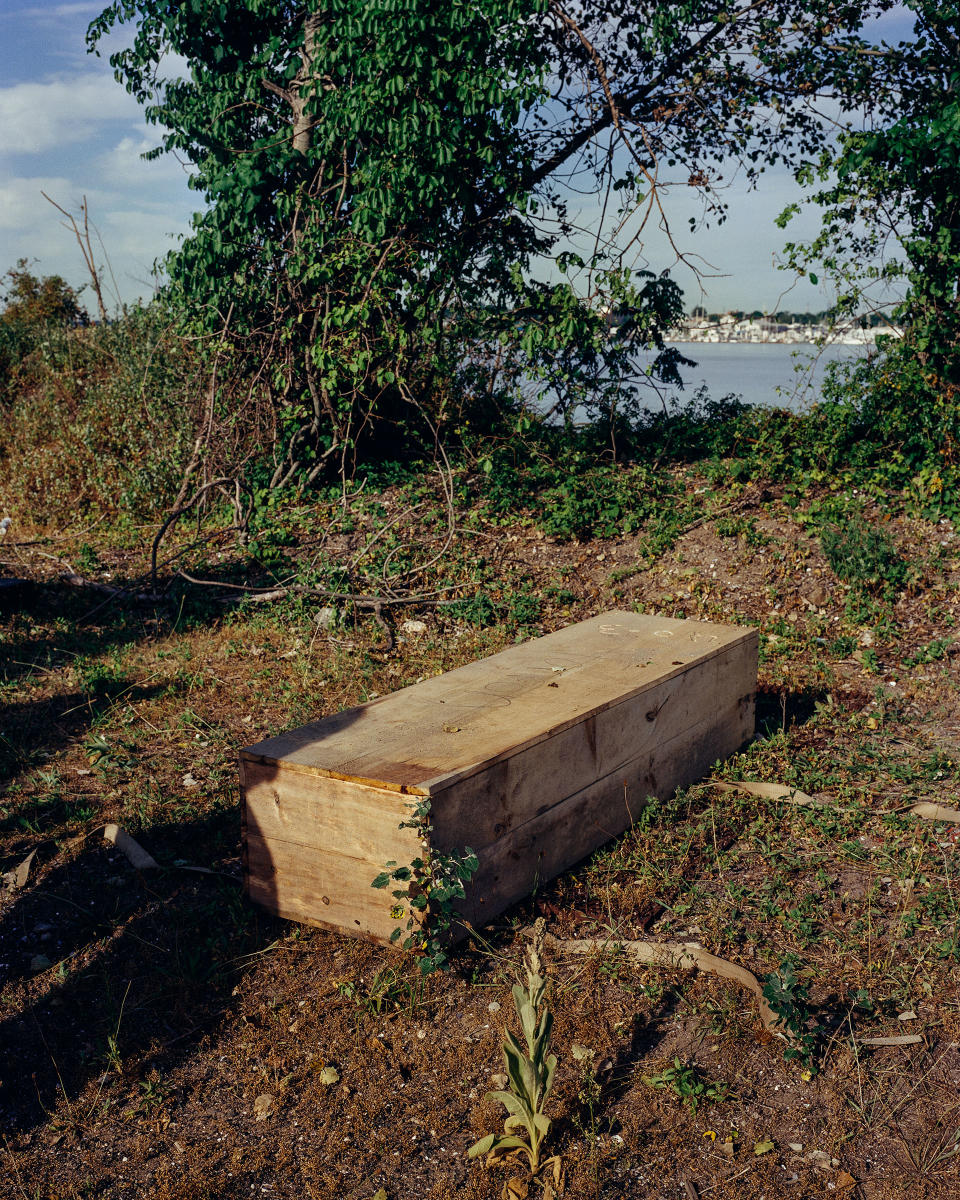 After being exhumed from Hart Island’s mass grave, Ellen Torron’s casket is prepared for the ferry ride back to the city.<span class="copyright">Sasha Arutyunova for TIME</span>