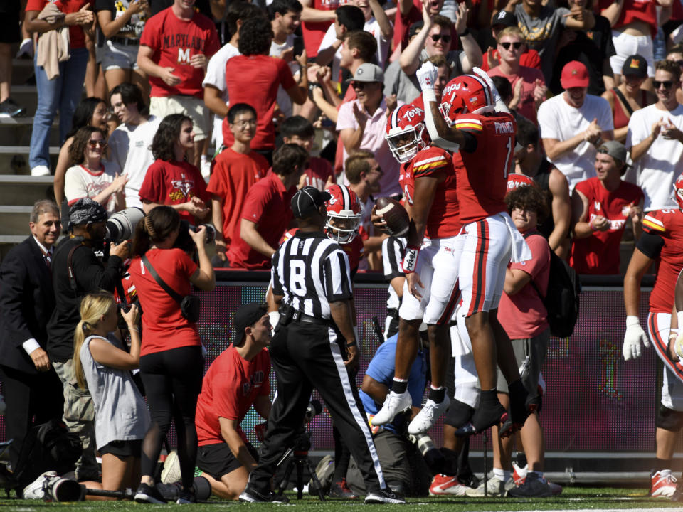 Maryland quarterback Taulia Tagovailoa (3) celebrates with wide receiver Kaden Prather (1) after running for a touchdown against Towson in the first half of an NCAA football game Saturday, Sept. 2, 2023, in College Park, Md. (AP Photo/Steve Ruark)