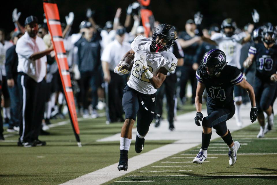 The Colony wide receiver Christian Gonzalez (22) runs past Frisco Independence defensive back John McGraw (14) during the first half of a high school football game at Memorial Stadium in Frisco, Friday, November 2, 2018. (Brandon Wade/Special Contributor Dallas Morning News)