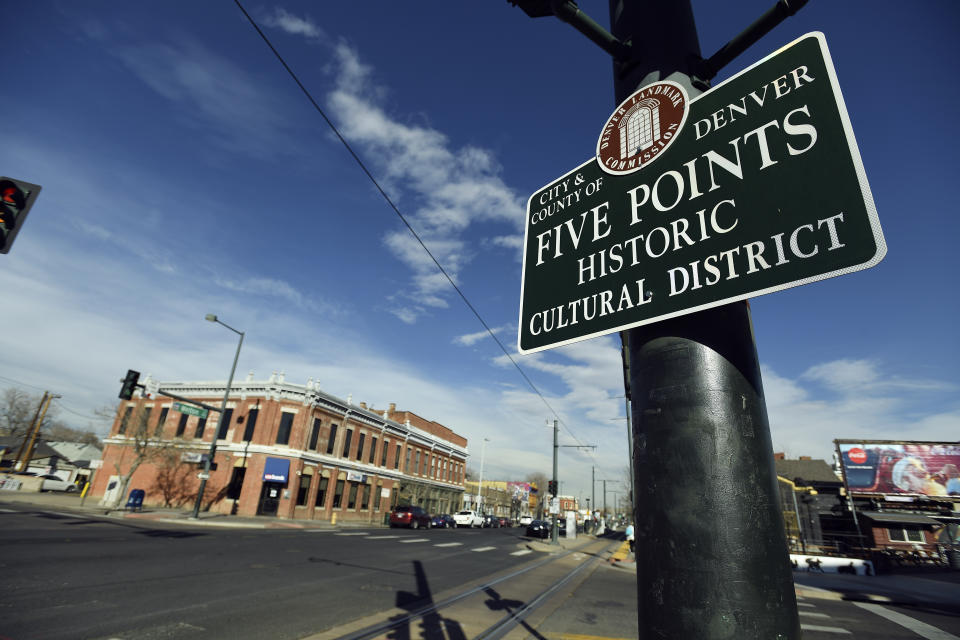 Street sign for the Five Points area of Denver with buildings in the background