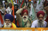 Farmers shout anti government slogans during a protest in New Delhi, India, Thursday, July 22, 2021. More than 200 farmers on Thursday began a protest near India's Parliament to mark eight months of their agitation against new agricultural laws that they say will devastate their income. (AP Photo/Manish Swarup)