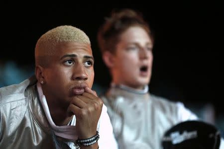 Miles Chamley-Watson (L) and Race Imboden of the U.S. react as their team is beaten by Italy during the men's foil team semifinals fencing competition at the ExCel venue during the London 2012 Olympic Games, August 5, 2012. REUTERS/Suzanne Plunkett